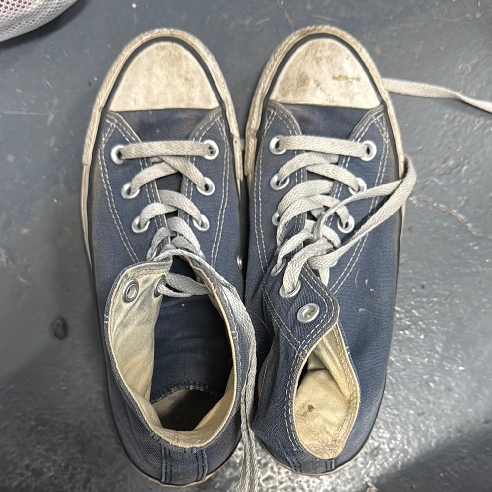 Well worn navy converse